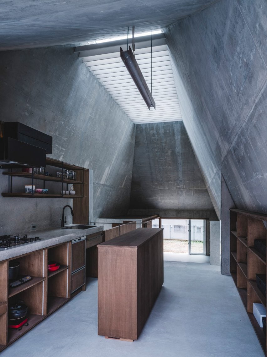 IGArchitects adds pyramidal concrete home to sloping site in Okinawa