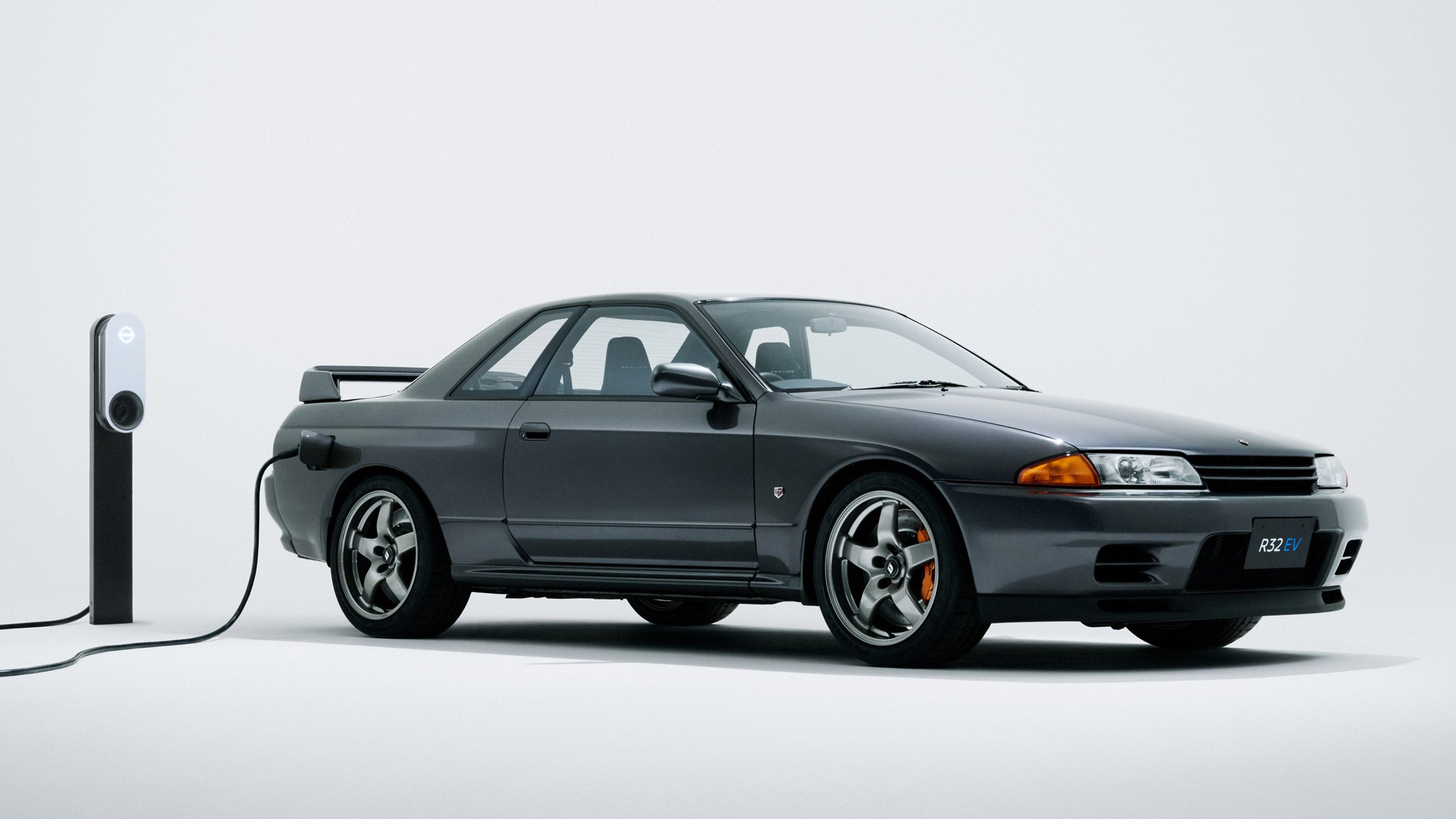 https://static.dezeen.com/uploads/2025/01/r32ev-concept-model-r32-skyline-gt-r-hero-1.jpg