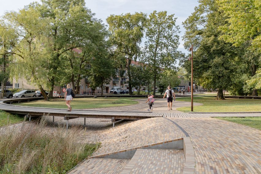 Brick path within new urban park designed by Sch&oslash;nherr