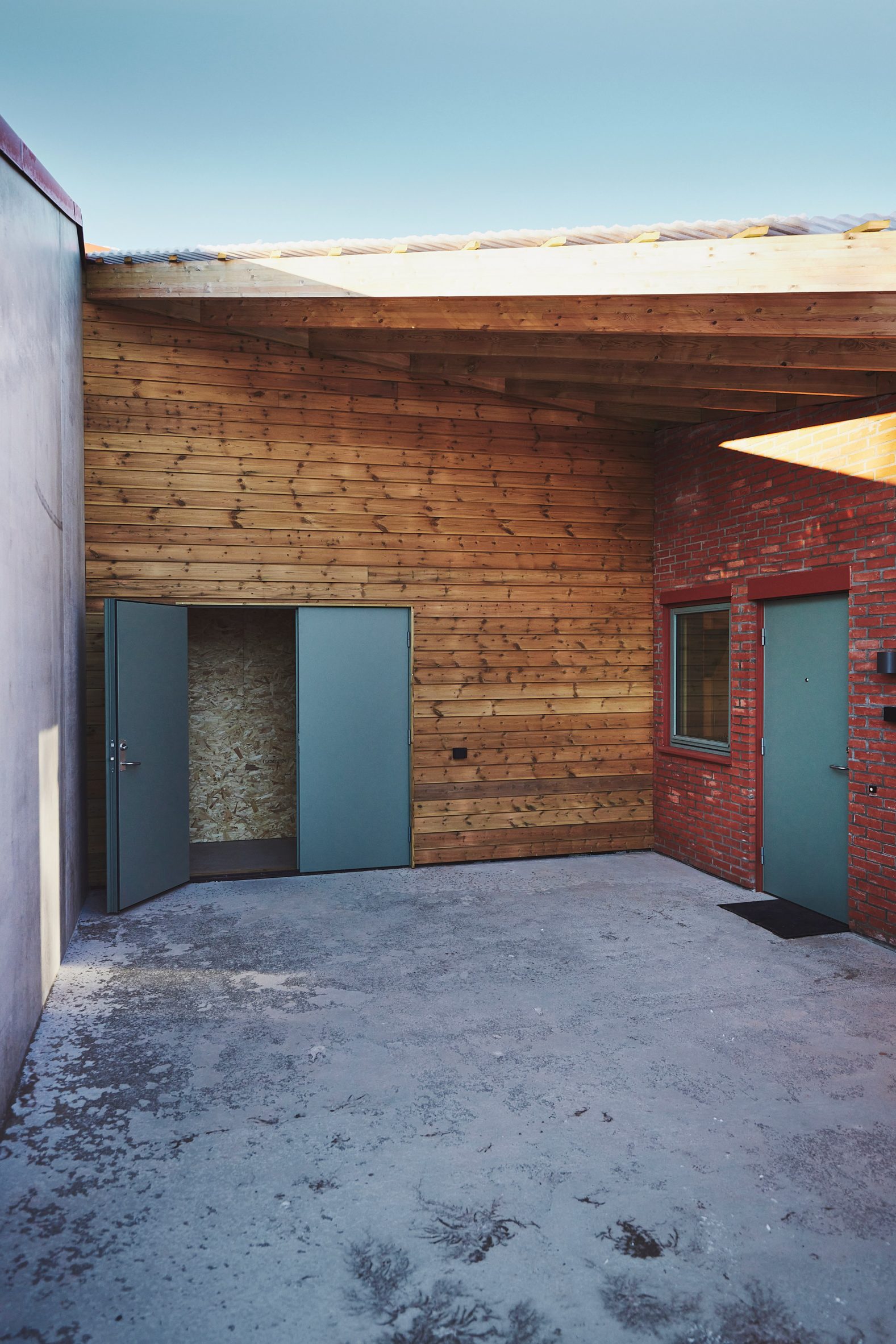 Courtyard area outside prototype homes by Snøhetta