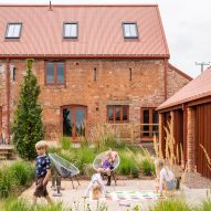 Stolon Studio converts 15th-century farm building into brick and timber housing complex