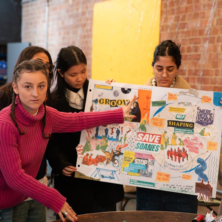 a photograph of students presenting their work