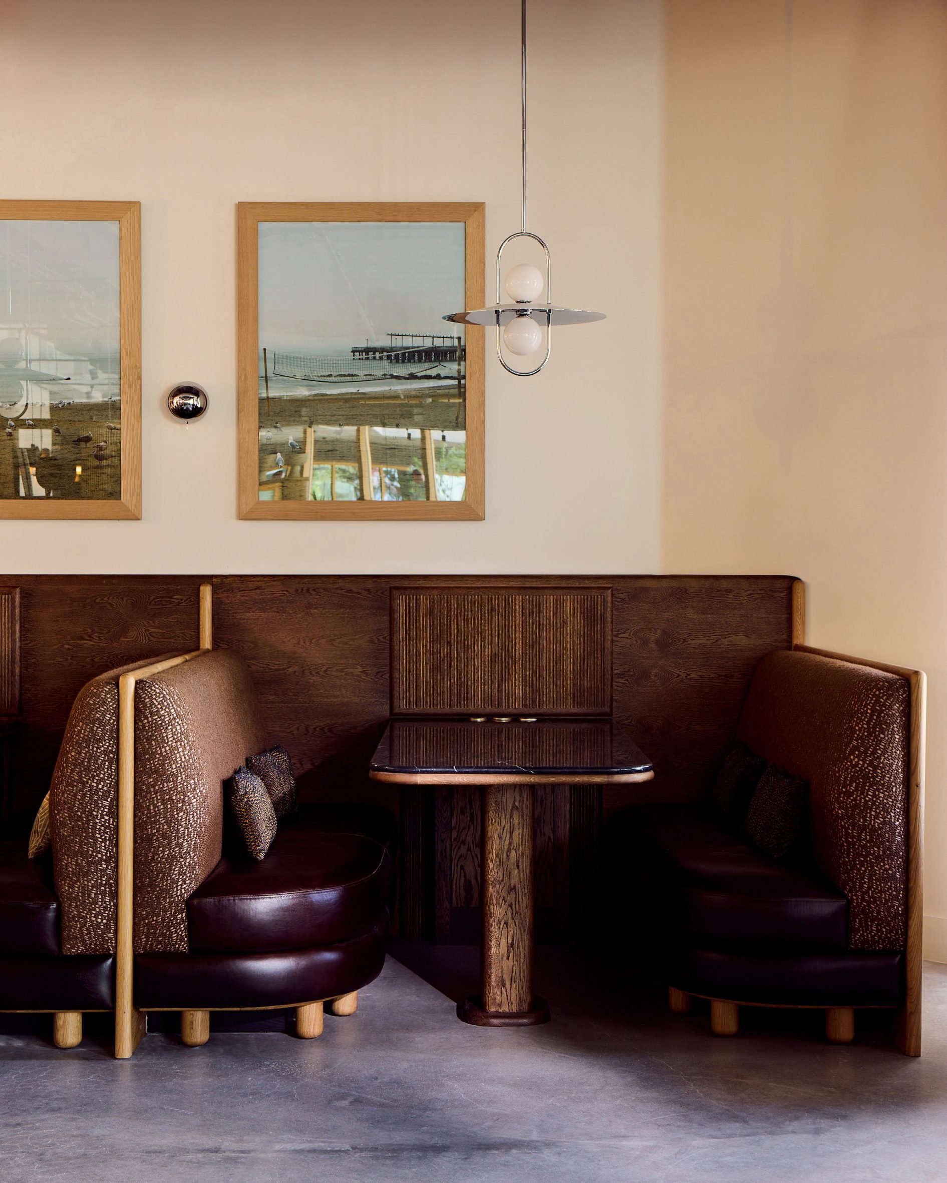 Booth seating with burgundy leather upholstery