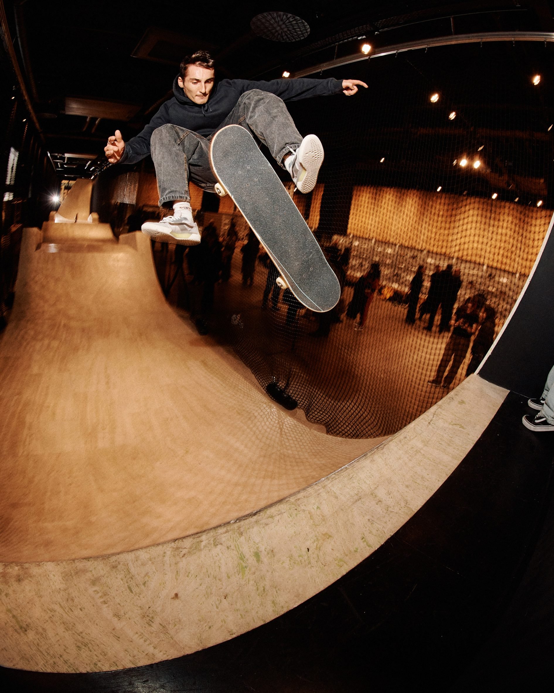 Man skating in Vans store