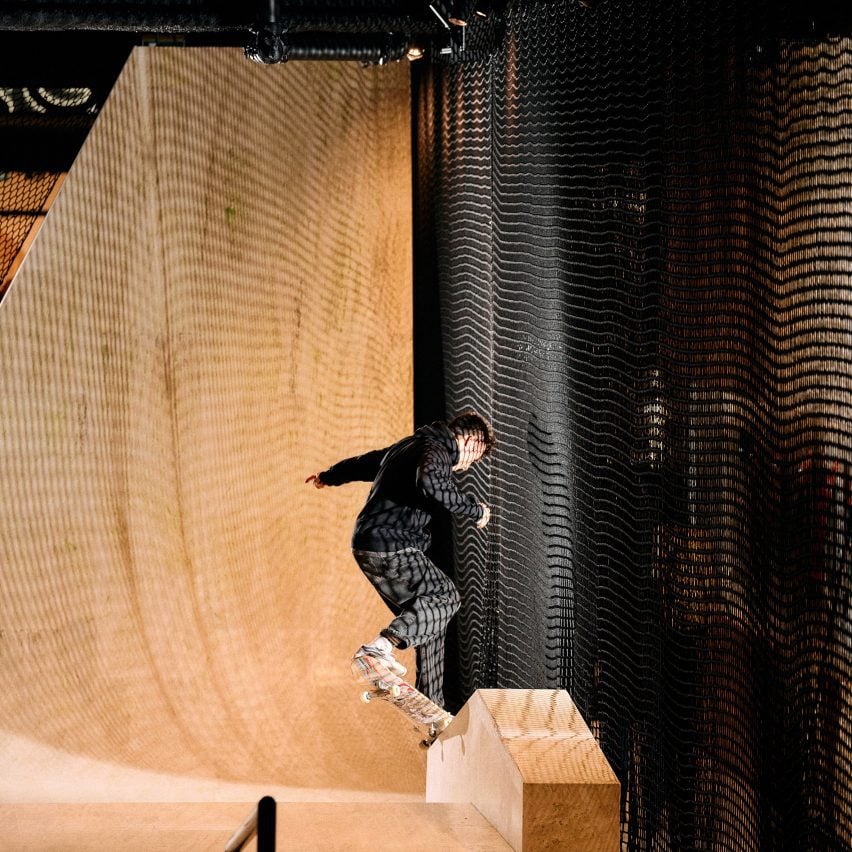 Man skating in Vans store