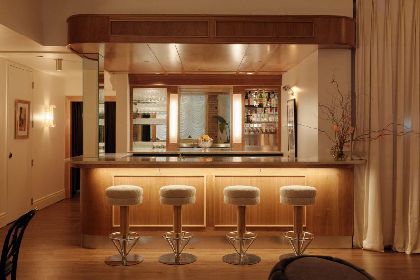 Wooden bar with cream bar stools