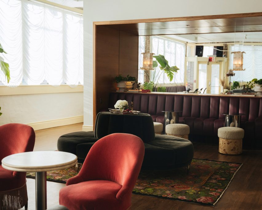 Mix of seating including green circular banquette and purple bench