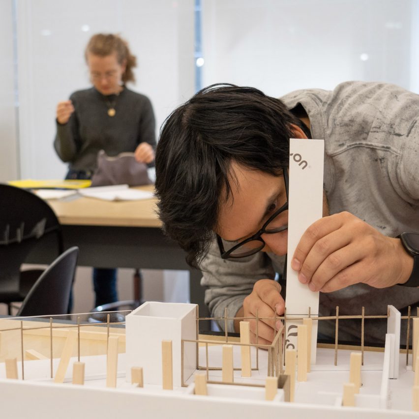 a student working on an architectural model