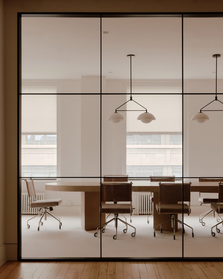 Conference room visible through large glass panels