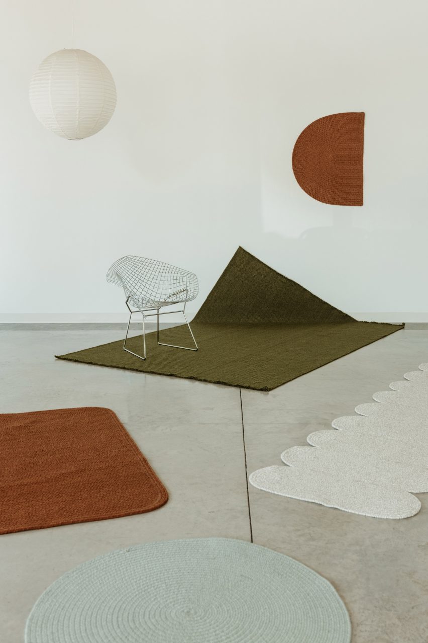Terracotta, white and green rugs by Cicil
