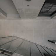 View peeking over staircase at Karimoky Research Center onto floor below