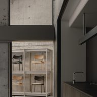 Kitchenette area with doorway looking onto chairs on display