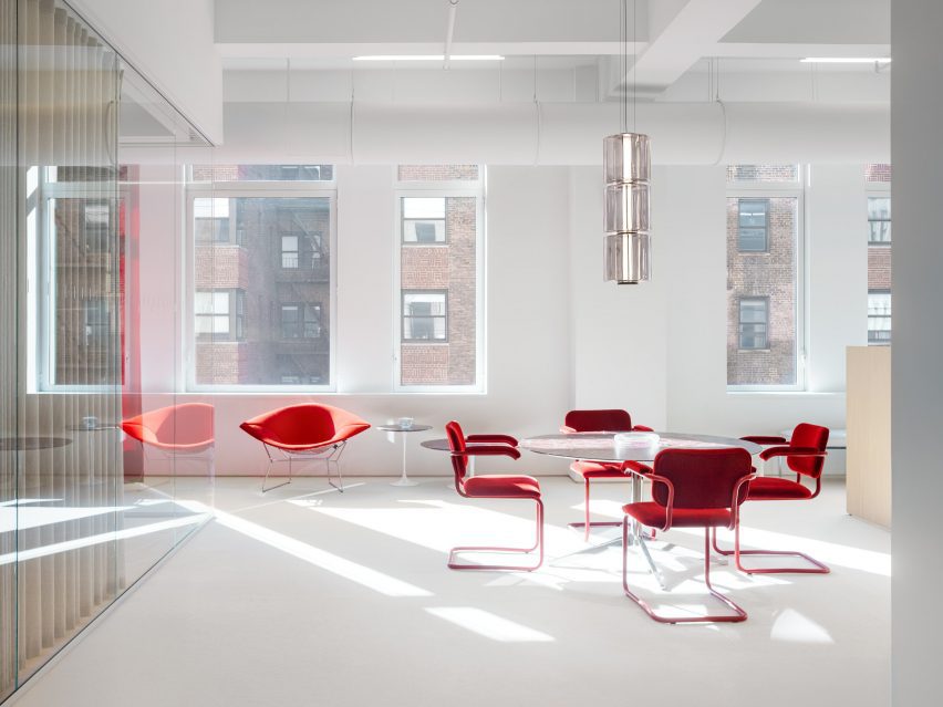 Red chairs in a bright white furniture showroom