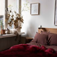 Bedroom with red throw