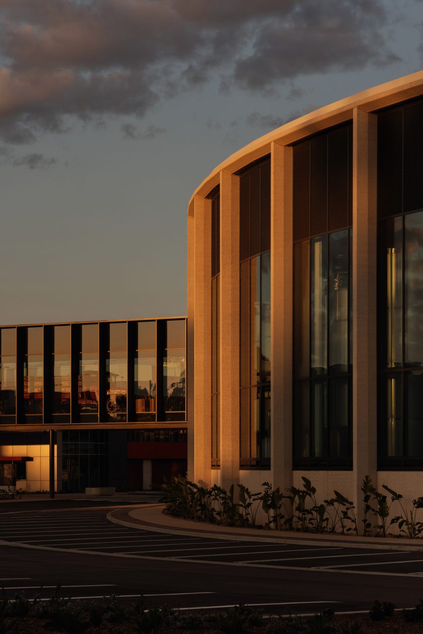 full-height glazed, curved building