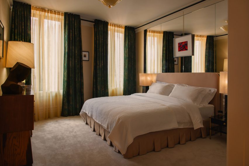Main bedroom of 60 Curzon with velvet curtains