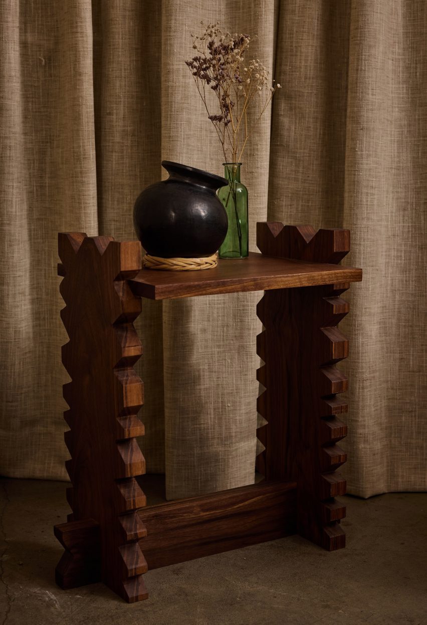 Wooden table with a pot and vase balance upon it