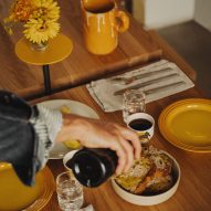 Close up photograph of the table spread, showing yellow crockery that has been incorporated into the scheme.