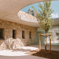 Amelia Tavella Architectes completes granite-clad school on craggy Corsican coast