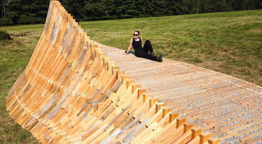 Person reclining on wooden structure