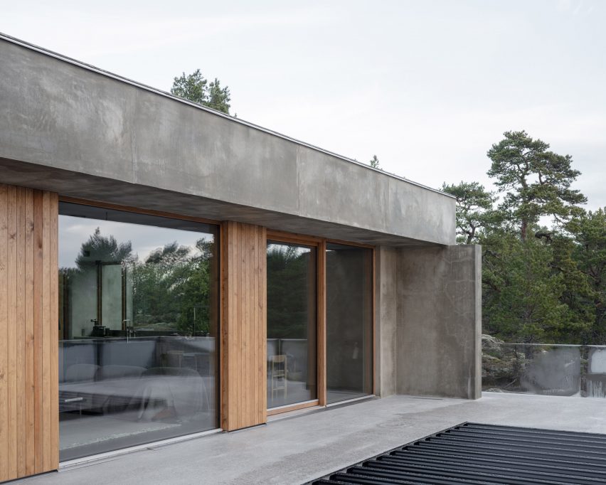 Rear facade of concrete home by Campus