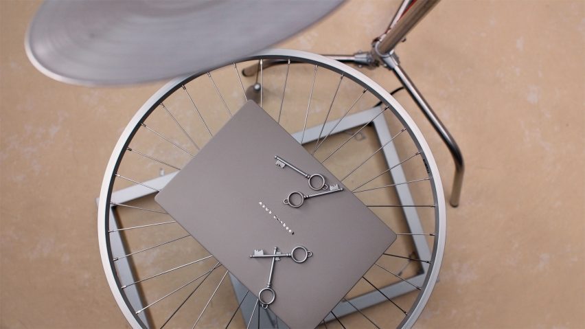 ASUS Zenbook perched on a wheel with keys on top of it