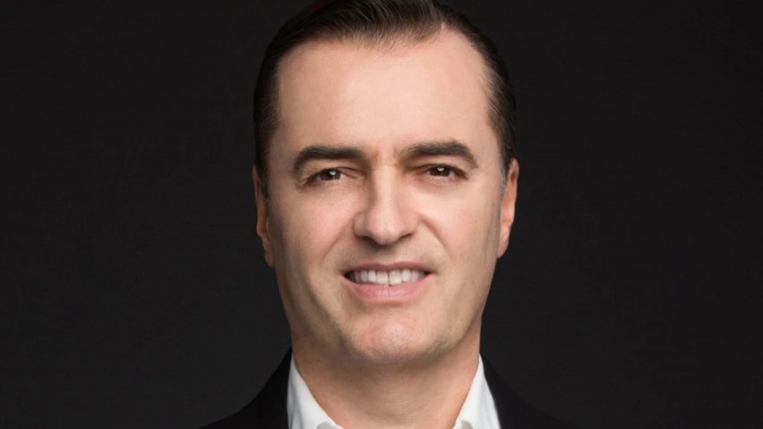 Patrik Schumacher portrait against black background