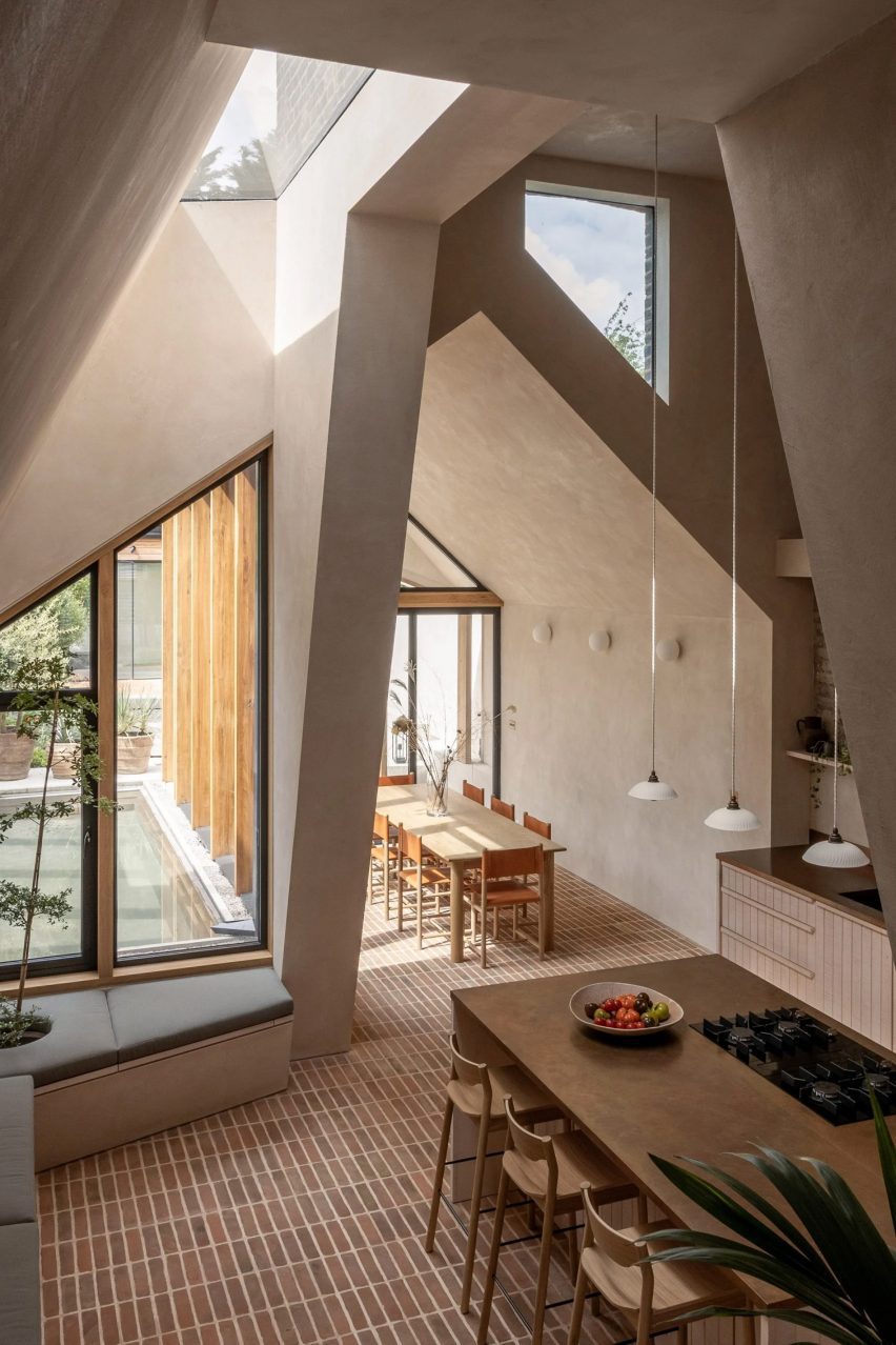 Organic textures feature throughout this double-height extension designed by Merrett Houmøller Architects