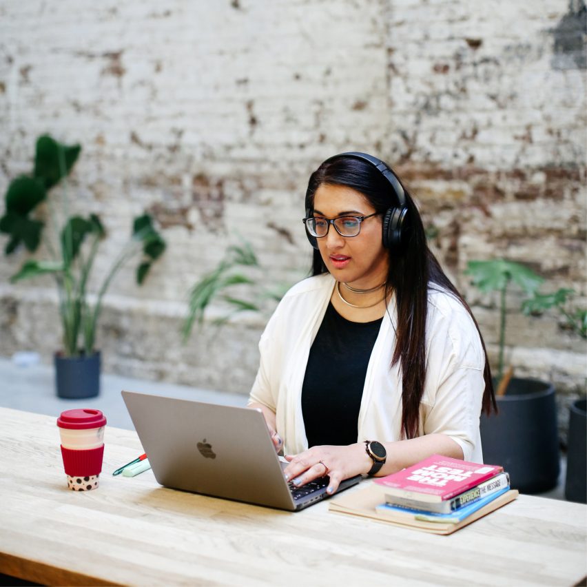 a student working on a laptop at a desk