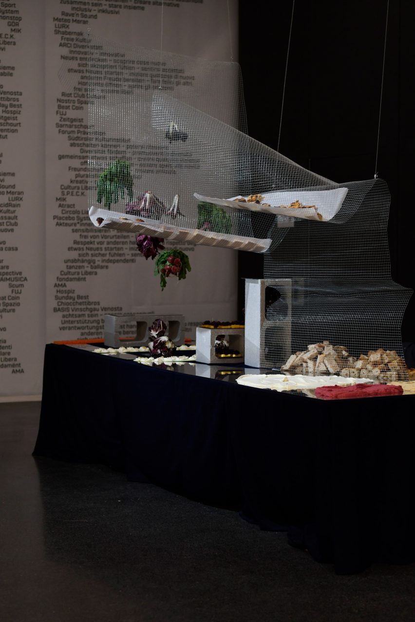 A photograph of an exhibition in dark tones.