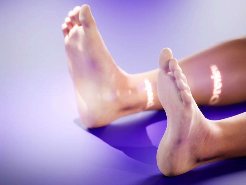 A photograph of a person's feet resting on a purple surface.
