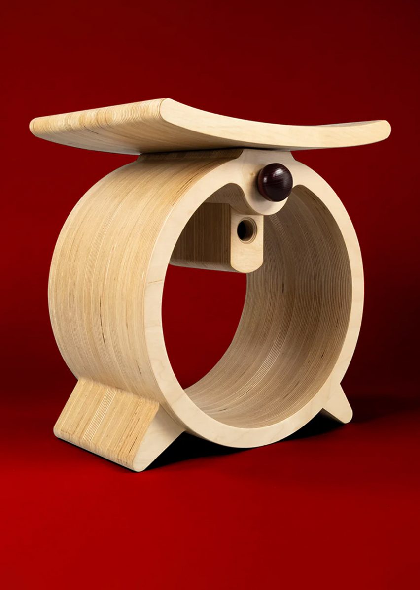 Wooden stool on red background