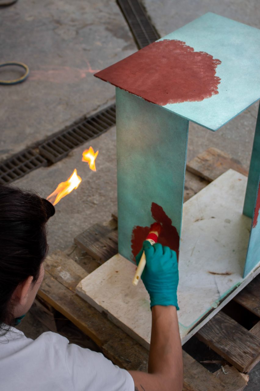 A student painting a table