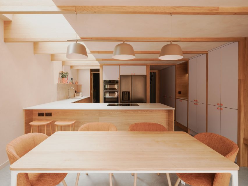 Kitchen and dining area within London home by Pensaer