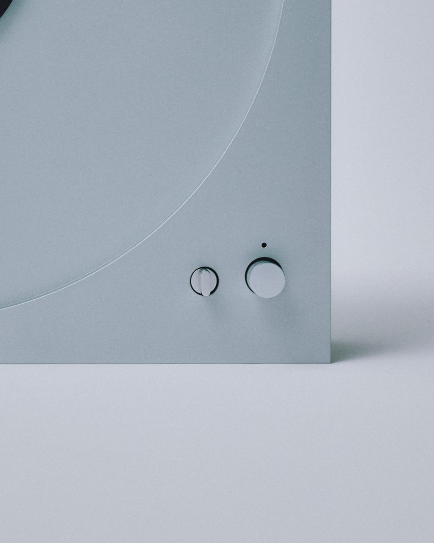 Close-up of two buttons on a record player