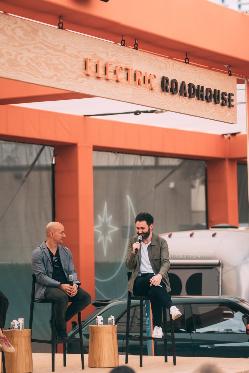 Photo of Jeff Hammoud and Ben Hobson on stage speaking on a panel