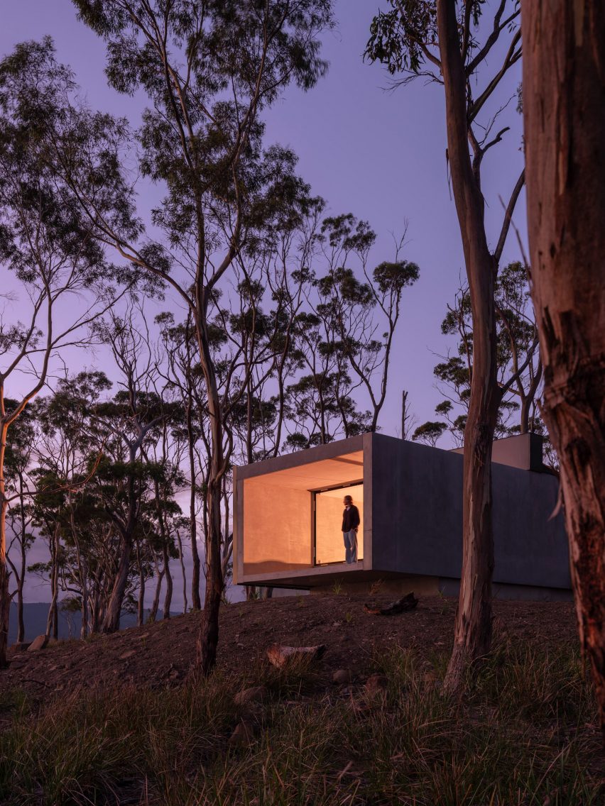 Exterior view of concrete guesthouse by Room11