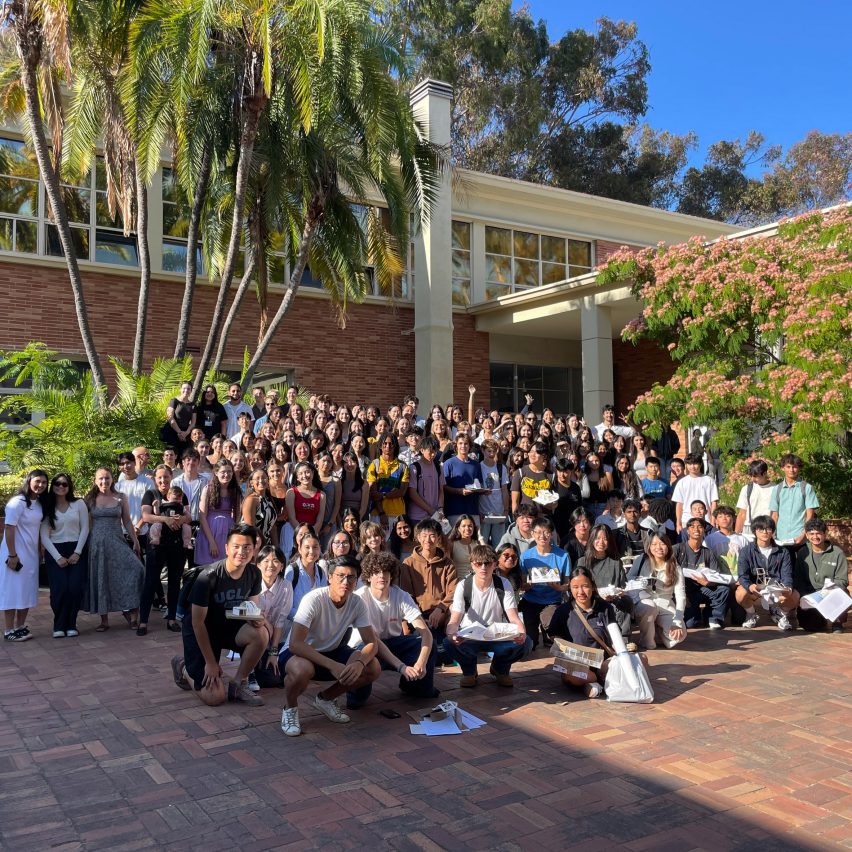 a photograph of a group of students in a courtyard