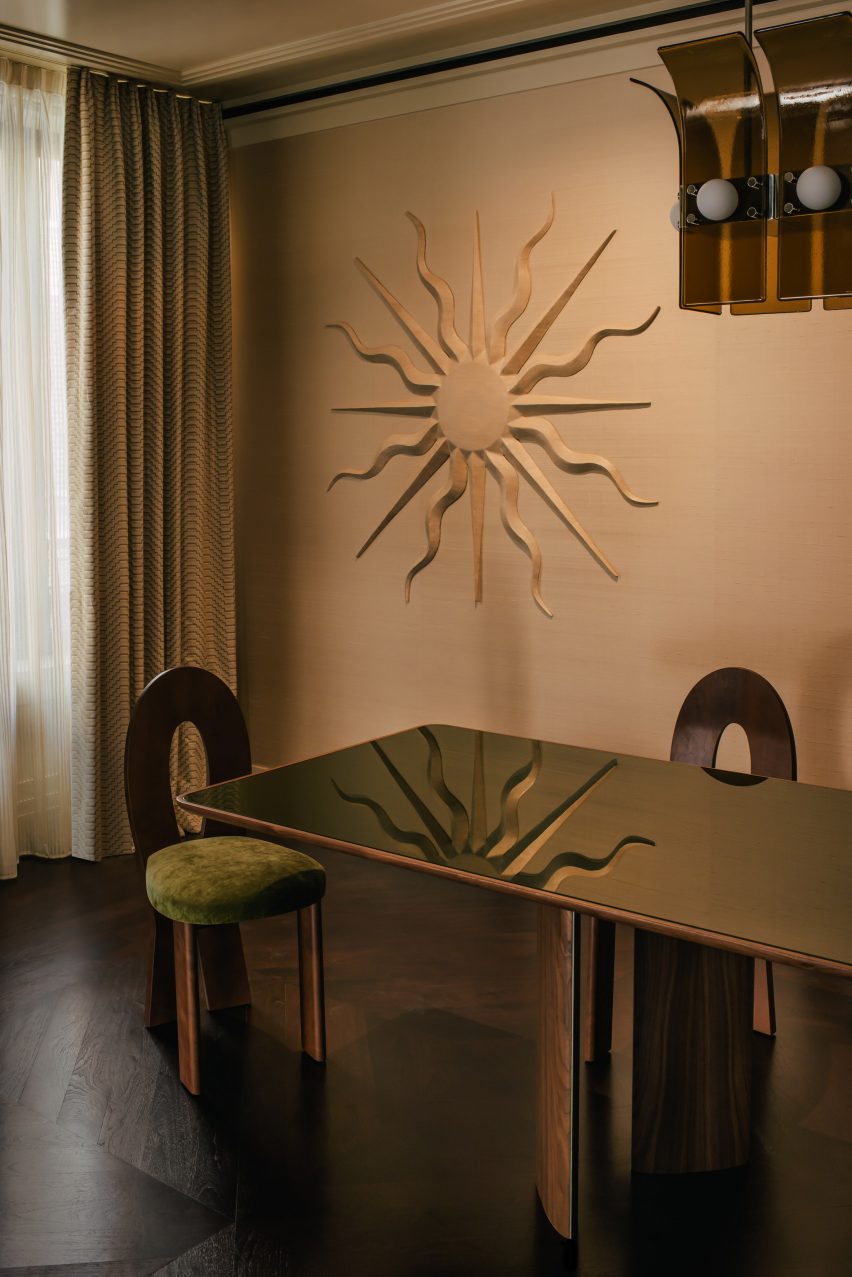 Sun sculpture on wall of Mayfair flat
