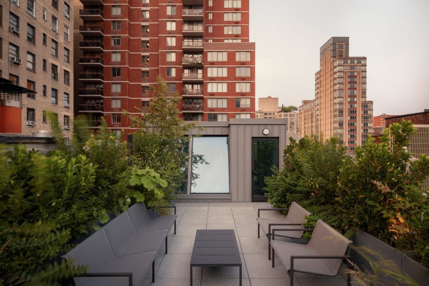 Rooftop terrace with canted skylights at the back