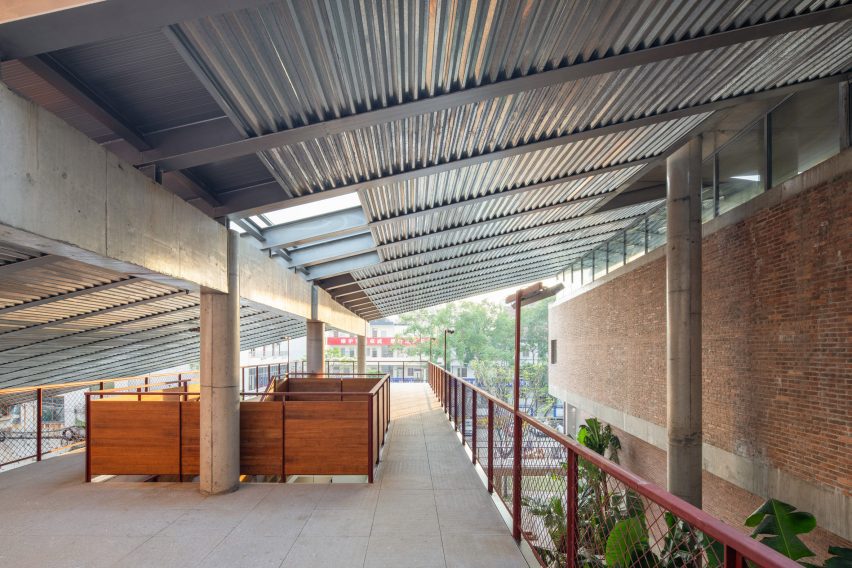 Sheltered walkway within community centre by WAU Design