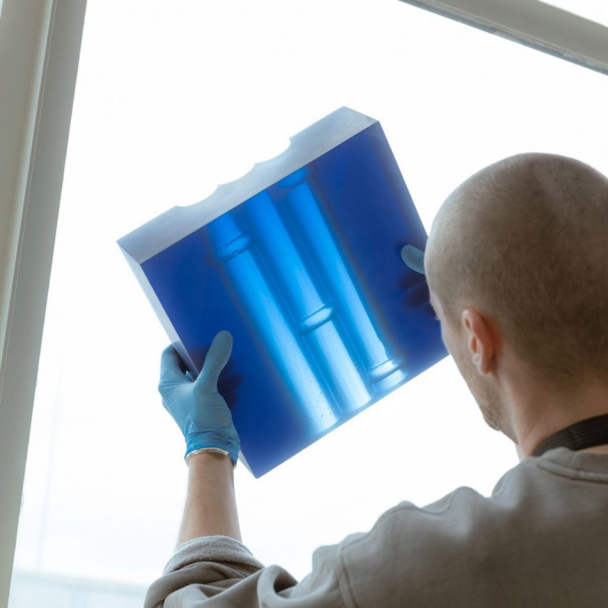 Designer holding up resin design