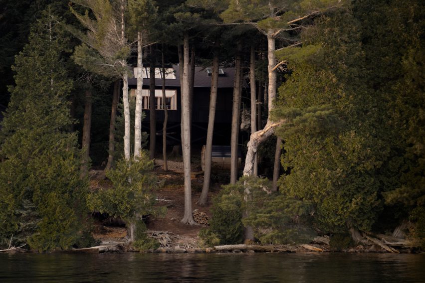 View across lake to cabin by Anya Moryoussef Architect