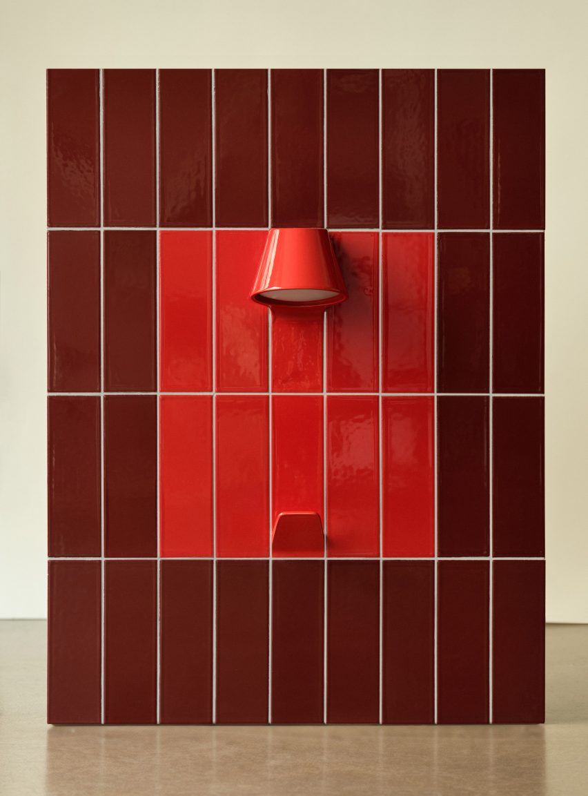 Red UU Tiles by Unknown Untitled with hook and light coming out of them