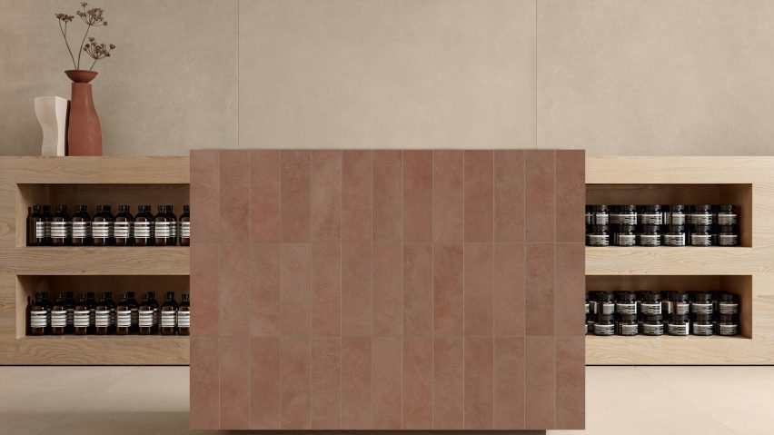 A photograph of wooden shelving units with cosmetics in them and a brown tiled counter in front