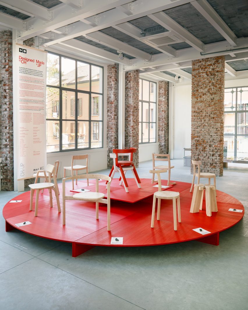 Wooden chairs on a red pedestal