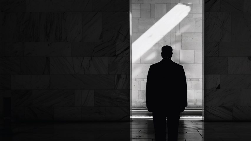 an image of a black silhouette against grey and black tones
