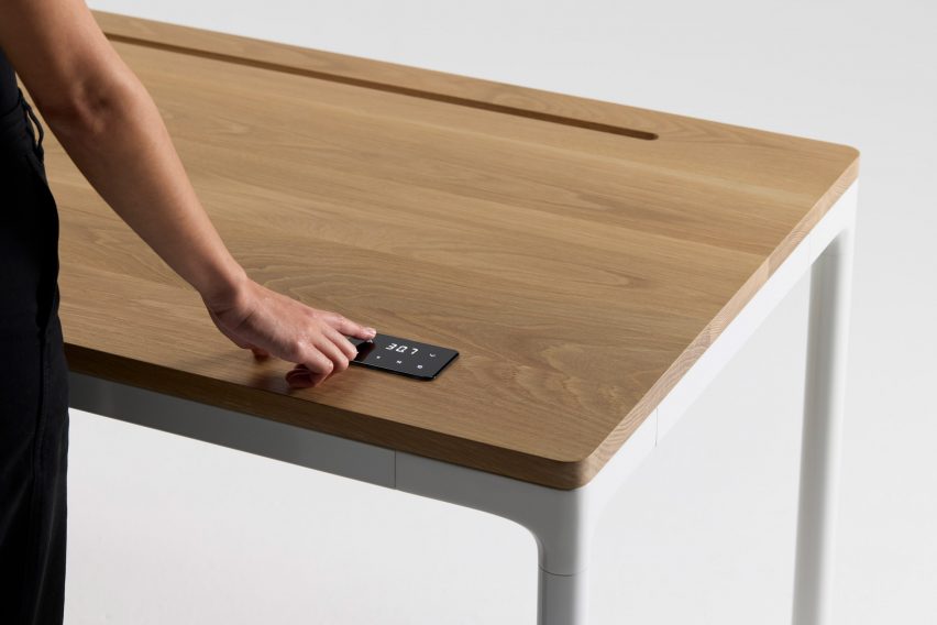Wooden surface of Humanscale sit/stand desk