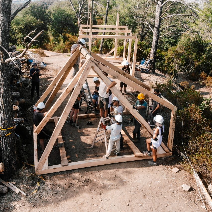 a photograph of a beige wooden structure outdoors