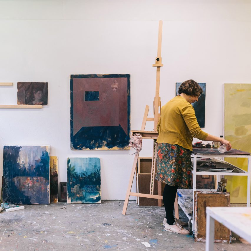 a photograph of a person in an artists studio